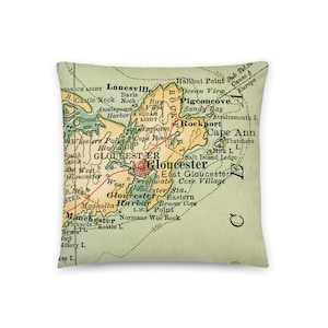 May include: A vintage map of the Gloucester, Massachusetts area, showing the coastline and surrounding towns. The map is printed on a green background with red lines and black text. The map includes the names of towns, landmarks, and bodies of water.