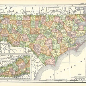 May include: A vintage map of North Carolina, showing the state's counties and major cities. The map is in a light brown colour scheme with green, yellow, and pink accents. The map includes a smaller inset map of the western portion of the state.