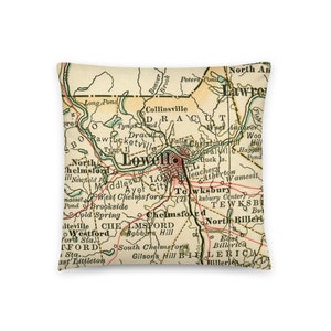 May include: An antique map of Lowell, Massachusetts, with surrounding towns and cities, including Chelmsford, Tewksbury, Dracut, and Billerica. The map is printed in brown, green, and red ink on a cream-colored background.