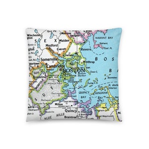 May include: A vintage map of Boston, Massachusetts, with a blue background and colorful borders highlighting the different neighborhoods and bodies of water. The map includes the names of various locations, including Boston Harbor, Quincy Bay, and Hingham Bay.