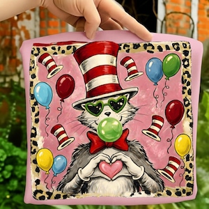 May include: Pink square graphic featuring a cartoon cat wearing a red and white striped hat and heart-shaped sunglasses. The cat is blowing a bubble and making a heart shape with its paws. Balloons and hats surround the cat.