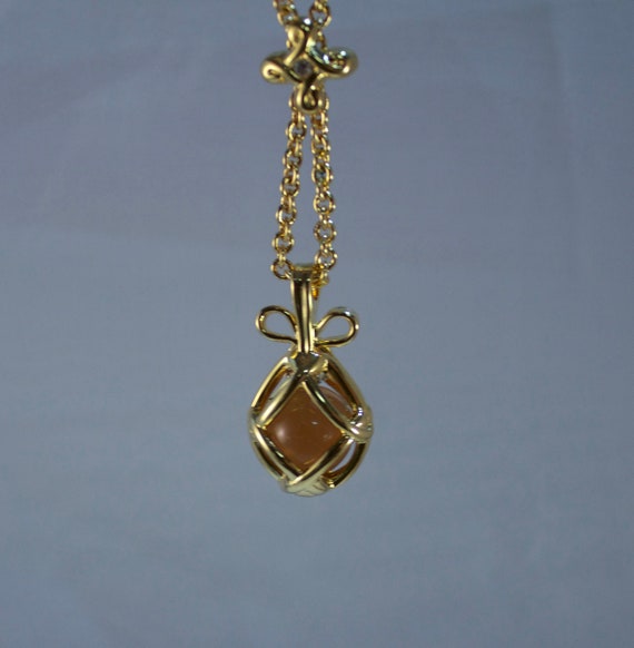 Joan Rivers Amber Glass Egg Pendant and Necklace