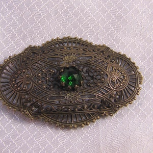 Victorian Throat Filigree Brass Throat Brooch with Green Glass Faceted Stone Center