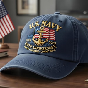 May include: Navy blue baseball cap featuring the text "U.S. NAVY" in gold lettering, along with an anchor and American flag design. The cap commemorates the "250th Anniversary" from 1775 to 2025, with the words "Honor, Courage, Commitment."