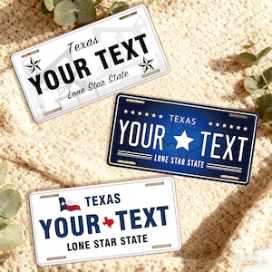 May include: Three Texas license plates with the text "YOUR TEXT" and "Lone Star State". One plate is white with a black oil derrick graphic, another is navy blue with a white star, and the third is white with a Texas flag.