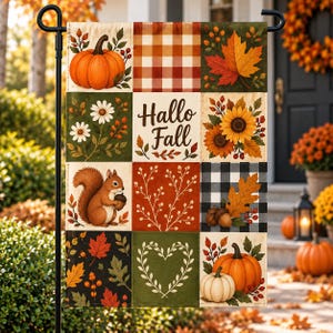 May include: A rectangular garden flag featuring a grid of nine panels with autumn themes, including pumpkins, sunflowers, a squirrel holding an acorn, and fall leaves. The center panel displays the text "Hallo Fall" in a dark brown script font.