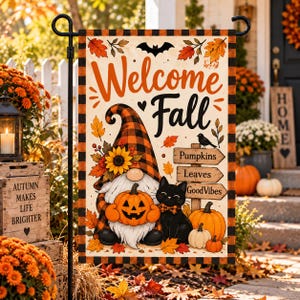 May include: A rectangular garden flag featuring a gnome wearing a plaid hat, a black cat, and pumpkins. The text reads Welcome Fall, Pumpkins, Leaves, and GoodVibes. The design includes autumn leaves, a sunflower, and a bat on a cream background.