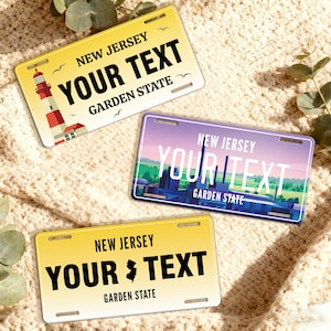May include: Three New Jersey license plates with customizable text. One plate features a lighthouse, another a factory scene, and the third a state outline. All plates have the text "NEW JERSEY", "YOUR TEXT", and "GARDEN STATE".