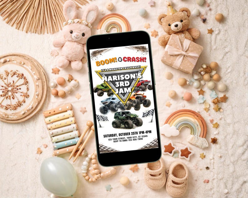 May include: A smartphone displays a birthday party invitation with monster truck graphics. The invitation reads "BOOM! & CRASH! HARISON'S 3RD JAM" with event details. The image is surrounded by toys and decorations, including a teddy bear and a rainbow.