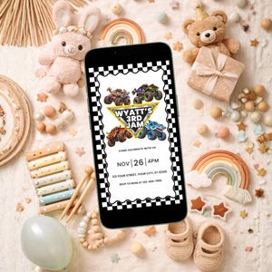 May include: A smartphone displaying a digital birthday invitation with a black and white checkered border. The graphic features four monster trucks, a yellow triangle, and the text: WYATT'S 3RD JAM, COME CELEBRATE WITH US, NOV 26 4PM.