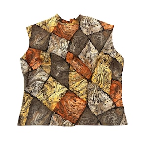 May include: A sleeveless mock neck top featuring a geometric patchwork pattern of marbled squares and rectangles in shades of burnt orange, golden yellow, dark brown, and cream. The fabric displays a swirling, fluid texture throughout each panel.