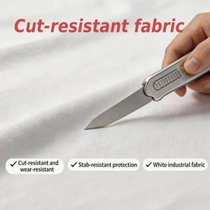 May include: A close-up of white fabric being cut with a silver utility knife. The text "Cut-resistant fabric" is in red at the top. Below are checkmarks with the text: "Cut-resistant and wear-resistant", "Stab-resistant protection", and "White industrial fabric".