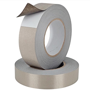 May include: Two rolls of gray and tan adhesive tape. One roll is stacked on top of the other. The top roll has a piece of the tan backing peeled back, revealing the white adhesive. The tape is designed for various applications.
