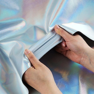 Tejido holográfico plateado de doble cara / Lámina iridiscente arcoíris, elástico e impermeable (se vende por metro)