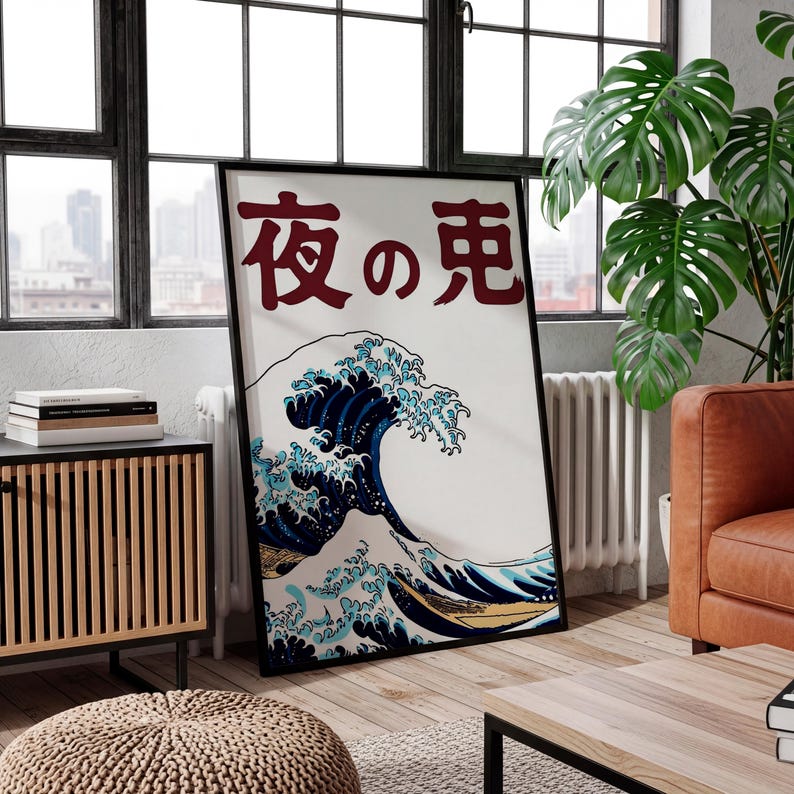 May include: Framed art print featuring a stylized Japanese wave design in shades of blue, white, and gold. The artwork includes Japanese characters in red at the top. The print is displayed in a black frame, adding a modern touch to the classic imagery.