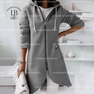 Casaco feminino longo com capuz e zíper, jaqueta casual de inverno com bolsos, agasalho para outono e inverno.