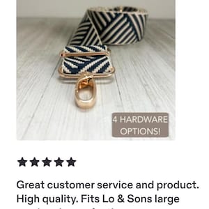 May include: A navy blue and white chevron patterned bag strap featuring rose gold metal hardware, including a swivel lobster clasp and an adjustable slider. A small rectangular sign displays the text 4 HARDWARE OPTIONS!