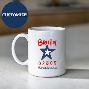 May include: White ceramic mug with the word "Bristol" in red script above a blue star with a white center. Below the star are the numbers "02809" and the words "Rhode Island" in blue. A blue circle with the word "CUSTOMIZE!" is in the upper left.