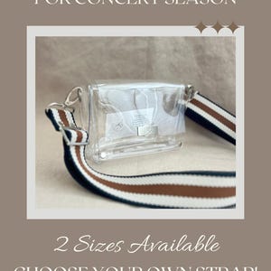 May include: A clear rectangular crossbody bag with a silver-toned metal clasp closure. The bag features a detachable, adjustable woven strap with horizontal stripes in navy blue, white, and brown. The text on the image reads: Your Perfect Companion FOR CONCERT SEASON, 2 Sizes Available, CHOOSE YOUR OWN STRAP!, www.kathrynbrooke.com.