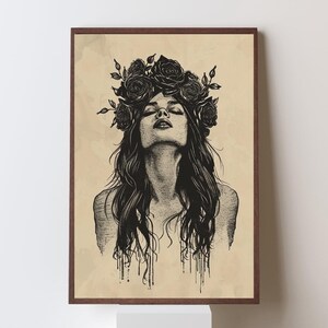 May include: A framed wall art print featuring a black ink illustration of a person with long hair and a crown of roses on their head. The person has their head tilted back with eyes closed. The background is a light tan color with a vintage paper texture.