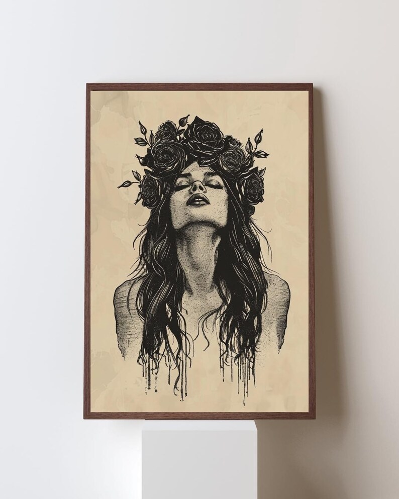 May include: A framed wall art print featuring a black ink illustration of a person with long hair and a crown of roses on their head. The person has their head tilted back with eyes closed. The background is a light tan color with a vintage paper texture.
