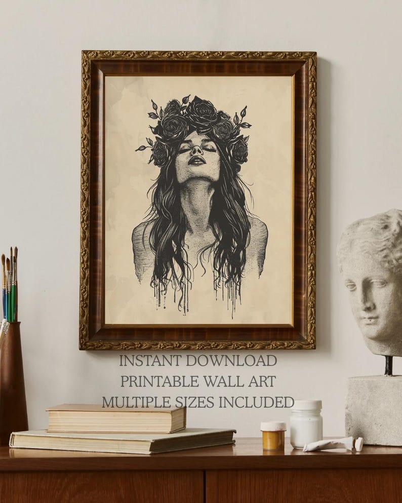 May include: A framed wall art print featuring a black ink illustration of a person with long hair and a crown of roses, looking upward. The text below reads: INSTANT DOWNLOAD, PRINTABLE WALL ART, MULTIPLE SIZES INCLUDED. The frame is dark brown wood.