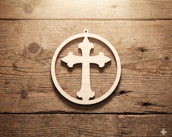 May include: A light-colored wooden cross ornament, featuring a cross shape within a circular frame. The cross has decorative flourishes on the ends of the arms. The ornament has a small hole at the top for hanging. The background is a rustic wooden surface.