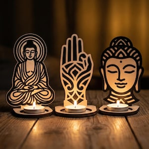 May include: Three wooden Buddha candle holders with intricate cut-out designs. The set includes a seated Buddha, a hand gesture, and a Buddha head. Each holds a lit tea light candle, casting a warm glow on the wooden surface.