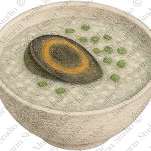May include: A bowl of congee, a rice porridge, topped with a preserved duck egg and green peas. The egg is dark with a golden-yellow ring. The bowl is light grey and has a textured appearance.