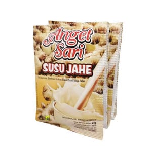 May include: Stacked packets of Angel Sari Susu Jahe, a powdered instant drink mix. The packaging features a creamy white liquid splash with a ginger root and the product name in red and white. The background has a light brown color.