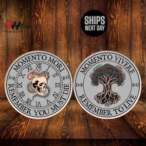 May include: Two silver-colored round coins with intricate designs. One coin features a skull with a snake and the words "MOMENTO MORI" and "REMEMBER YOU MUST DIE". The other coin shows a tree and the words "MOMENTO VIVERE" and "REMEMBER TO LIVE".