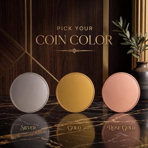 May include: Three round coins in silver, gold, and rose gold are displayed on a marble surface. The text "PICK YOUR COIN COLOR" is above the coins. Below each coin is the text "Silver", "Gold", and "Rose Gold".