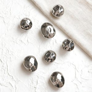 May include: A weathered wooden sign, inscribed with "Welcome to our home" in a handwritten font. The sign has a distressed appearance, ideal for a porch or hallway, and is designed to create a welcoming atmosphere.