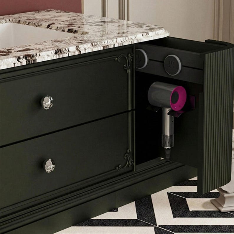 May include: A white ceramic mug with a black handle and the text "But First, Coffee" in a black, handwritten-style font. The mug is on a white surface.