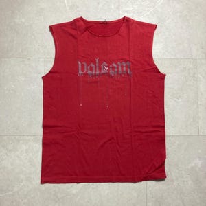 May include: A set of three ceramic mugs with a speckled, matte finish. The mugs are in shades of cream, light gray, and dark gray. Each mug has a simple, minimalist design and a rounded handle.