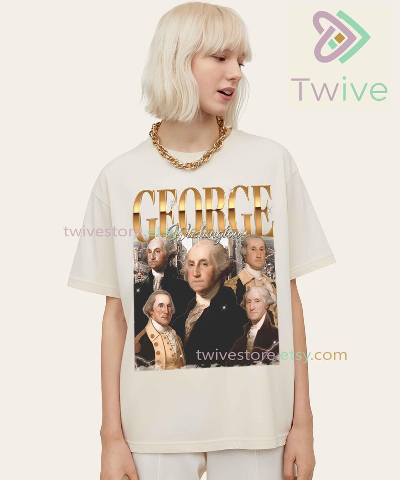 May include: Cream-colored t-shirt featuring a graphic of George Washington with the word "GEORGE" in gold lettering. The shirt also includes the text "Washington" and the Etsy shop's URL.