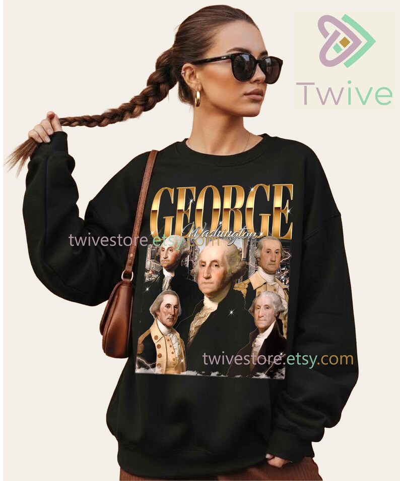 May include: Black sweatshirt featuring a graphic of George Washington and the text "GEORGE Washington" in gold lettering. The sweatshirt has long sleeves and a crew neck. The Etsy shop name "twivestore.etsy.com" is also visible.