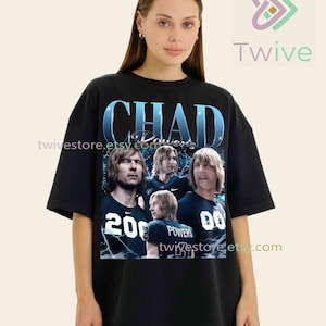 May include: Black t-shirt featuring a vintage-style graphic of the name "CHAD POWERS" above a collage of four men. The shirt includes the numbers "20" and "00" on the front, with the name "POWERS" on the back. The design has a retro aesthetic.
