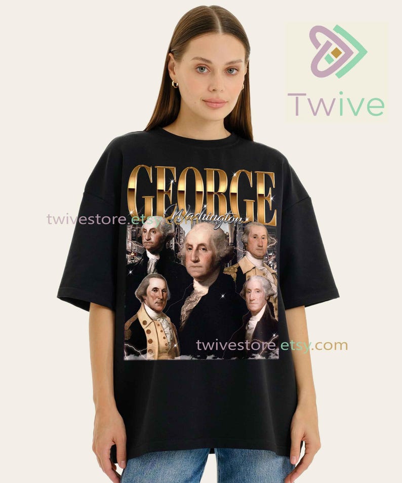 May include: Black oversized t-shirt featuring a gold-colored graphic of George Washington and the text "GEORGE Washington". The graphic includes portraits of George Washington. The shirt has short sleeves and a crew neck.
