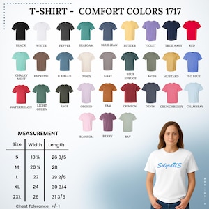 May include: A variety of Comfort Colors 1717 t-shirts in various colors, including black, white, and red. The image also displays a size chart with measurements in inches, ranging from S to 2XL. A woman is wearing a white t-shirt.