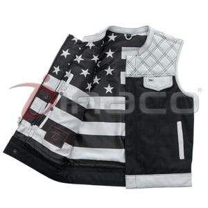 May include: Black vest with white accents and a quilted shoulder design. The interior lining features a black and white American flag pattern. The vest has a zippered front and multiple pockets.