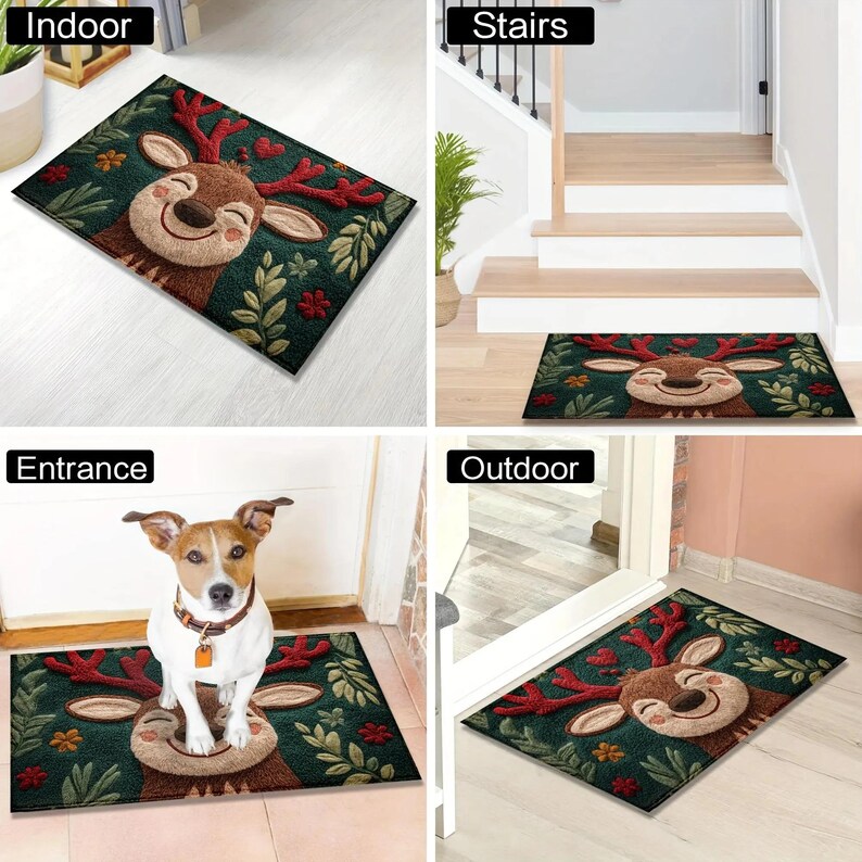 May include: A rectangular doormat featuring a smiling reindeer with red antlers and a beige face, set against a dark green background with floral and leaf accents. The mat is suitable for indoor and outdoor use.