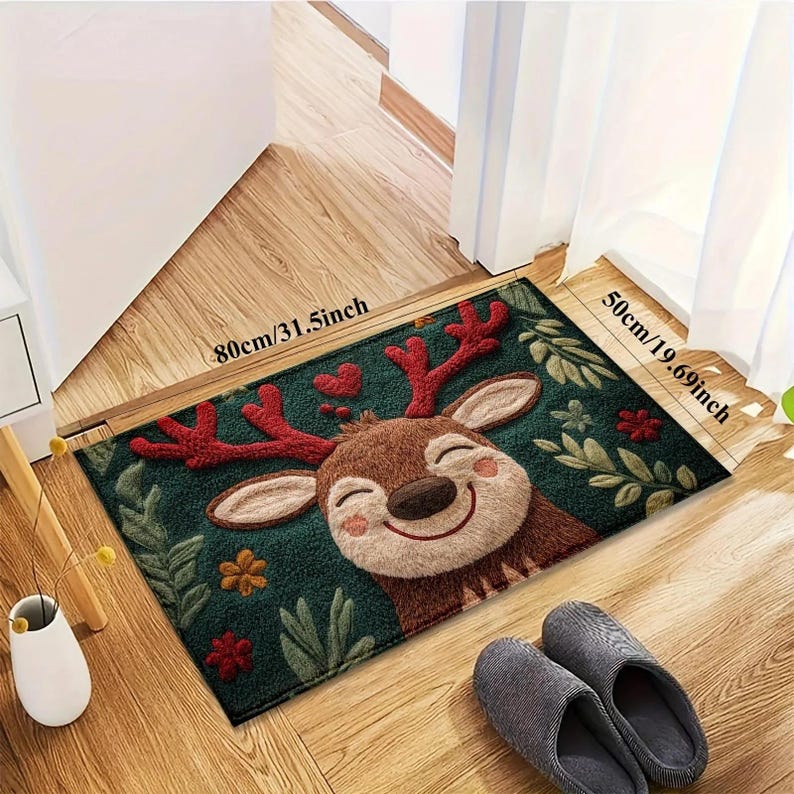 May include: A rectangular doormat featuring a smiling cartoon reindeer with red antlers and a green background with leaves and flowers. The mat measures 31.5 inches by 19.69 inches.