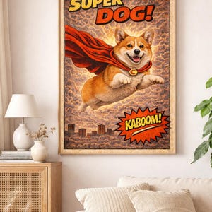 May include: A framed wall art print featuring a cartoon corgi flying through the air wearing a red cape with a yellow C emblem. The text SUPER DOG! appears at the top, and a jagged orange burst with the word KABOOM! is at the bottom.