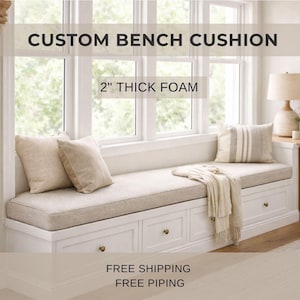 May include: A custom bench cushion with 2" thick foam. The neutral-toned cushion sits on a white bench, complemented by decorative pillows and a throw. The text "CUSTOM BENCH CUSHION" and "2" THICK FOAM" are displayed.