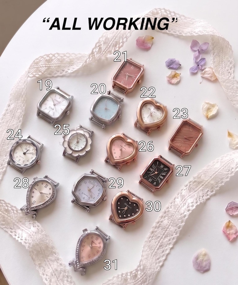 May include: A collection of thirteen assorted wristwatch cases labeled 19 through 31, featuring various shapes including heart, rectangular, and octagonal designs in silver, gold, and rose gold tones, with the text ALL WORKING displayed above.
