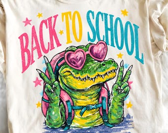 Imagen PNG de un caimán de regreso a clases, diseño de camiseta de profesor con un lindo caimán, sublimación para el primer día de clases, descarga digital retro de moda.