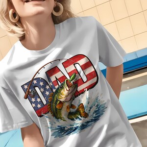 White t-shirt mockup featuring a patriotic bass fishing dad sublimation design with American flag lettering and a jumping bass fish, ideal for Father's Day and 4th of July fishing apparel