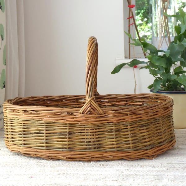 A handmade oval willow basket with handle