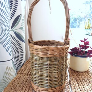 A small handmade willow basket with handle